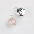 Detail of silver alloy pendants with pink crystal inlay and hammered texture back - Silver Base Pale Pink