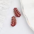 Macro detail of deep red leaf glass beads with gold gilding veins for DIY jewelry - Transparent Red (00590501)