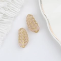 Close-up of pink leaf-shaped Czech glass beads with gold veins for DIY jewelry - Jade Pink (00590601)