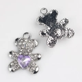 Detailed view of silver-plated bear pendant with white zircons and purple heart stone - Silver Purple