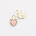 Detailed view of gold heart lock charm with pink enamel center and cubic zirconia bezel - Gold Pink