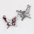 Macro detail of alloy butterfly pendant with pearls and red-white enamel inlay - Gun Black Base Red White