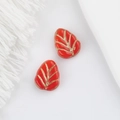 Detail of red Czech glass leaf beads with gold veining for DIY jewelry making - Red