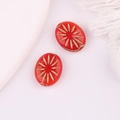 Detail of red oval Czech glass beads with gold starburst pattern for DIY jewelry - Red