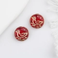 Macro view of translucent red Czech glass beads with gold duck pattern for DIY jewelry - Transparent Red