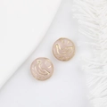 Close-up of pink translucent Czech glass beads with gold-painted bird for DIY jewelry - Pink