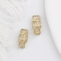 Detailed view of owl-shaped glass beads with gold foil for DIY handmade jewelry crafts - Clear