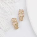 Detailed macro view of pink glass owl beads with gold etched patterns for DIY jewelry - Light Pink