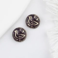 Macro detail of dark purple Czech glass beads with gold bird pattern and vintage finish - Dark Purple