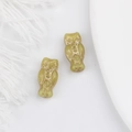 Detailed macro view of light green owl glass beads with exquisite gold-painted feather patterns - Yellow
