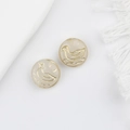 Macro view of vintage cream glass beads with gold-etched swimming bird pattern - Jade White