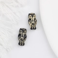 Detailed view of vintage black owl beads with intricate gold engraving for DIY crafts - Black