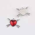Detailed front and back view of silver heart and arrow charms with red resin inlay - Silver Red