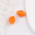 Détail macro de perles citron orange avec texture réaliste pour la création de bijoux DIY - Orange