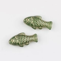 Detailed view of hand-painted green glass fish beads with golden scale texture for DIY jewelry - Transparent Green