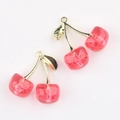 Close-up of translucent glitter cherry charms with golden leaves for DIY jewelry making - Gold Magenta