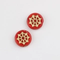 Detailed macro of red Czech glass beads featuring gold-painted spider web wheel patterns - Red (00670801)