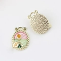 Detailed view of floral alloy pendant with pink enamel and pearl inlay for DIY jewelry - Oval Gold Pink