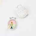Detail of silver alloy oval pendant with pink enamel and star texture backing - Oval Silver Pink