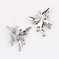 Macro view of butterfly alloy pendant with purple enamel and heart-shaped cubic zirconia - Silver Base + Purple Rhinestone
