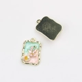 Detail of rectangular enamel charms with mint green pink inlay and pearl accents - Gold Green Pink Base