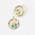 Detailed close-up of pink enamel floral charms with pearl inlay and golden textured back - Round Gold Pink