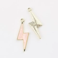 Detail of pink resin lightning bolt charms with gold metal frame and star texture back - Gold Pink