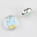 Macro detail of enamel astronaut space bead with blue background for DIY jewelry crafts - Bright Silver Base Sky Blue