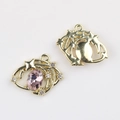 Front and back detail of a gold celestial star charm with a pink oval gemstone - Gold Purple Zirconia