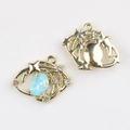 Macro shot of gold starry moon pendant with blue stone and white zircon for DIY jewelry - Gold Plated Blue Zirconia