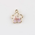 Detail of flower charm with purple enamel gradient, pink butterfly, and rhinestone inlay - Purple with Black Stars