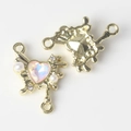 Macro view of heart-shaped gold alloy connector with opal stone and pearl details - Gold Pink