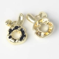 Detail of bunny donut charms showing black enamel glaze and golden alloy base - Gold Base Black