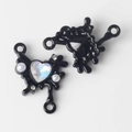 Macro view of black heart jewelry connector with gemstone and pearl for DIY necklace making - Black Blue