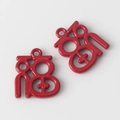 Detail view of two red hollow Fu pendants with glossy finish for DIY jewelry making - Red