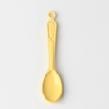 Close-up of a bright yellow spoon charm with geometric embossed handle and hanging hole - Yellow