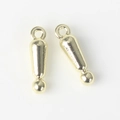 Macro detail of gold-toned alloy exclamation mark pendants for DIY jewelry making - Gold