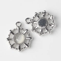 Macro shot of silver sun pendants with white cat eye stones and metallic back details - Silver Base White