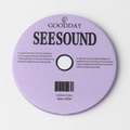 Close-up of a matte lavender round acrylic CD charm with SEESOUND text and 2024 mark - Purple