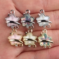 Handheld display of six colorful star shaped alloy pendants for DIY jewelry making - Random Mix