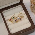 Golden branch brooch with freshwater pearls and colorful gemstones in a luxury jewelry box - Brooch / 18K Gold