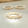 Handmade stretch pearl ring featuring a textured gold bead center for women - Large Bead Style