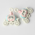 Detail shot of colorful alloy pumpkin carriage charms for DIY jewelry making - White