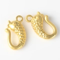 Detailed close-up of golden fish-shaped alloy connectors for DIY jewelry making - Gold