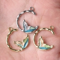 Hand-held view of alloy fishtail pendants with colorful enamel in C-ring frame - Random Mix