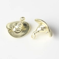 Macro detail of golden alloy witch hat pendants with textured finish for DIY jewelry - Gold