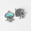 Macro view of silver jellyfish alloy charms with resin inlay and textured back detailing - Silver Base Green
