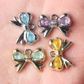 Colgantes de lazo con circón para collares y pulseras DIY en acabados oro y plata - Mezcla Aleatoria