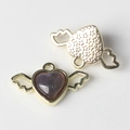 Detail showing gold heart wings pendant with sparkling purple resin and star relief - Gold Black