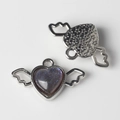 Macro detail of alloy heart pendant with purple glitter resin and angel wings design - Silver Purple